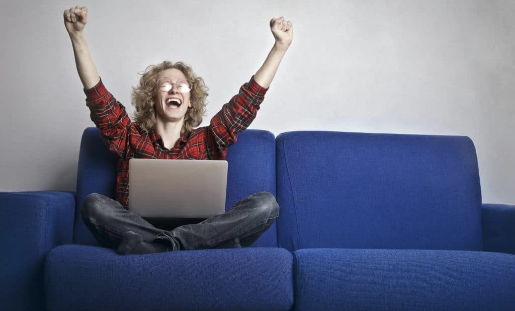 man excited for online hustles